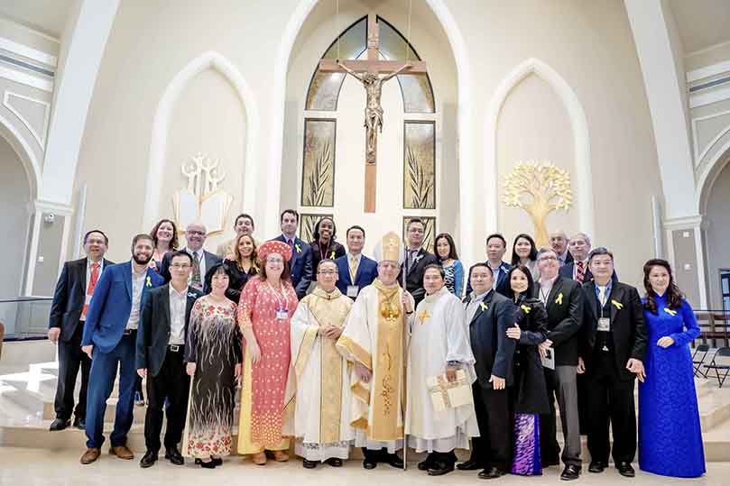 On the day of the dedication for Holy Vietnamese Martyrs Church, Norcross, a number of people who worked so diligently on the project were attendance. The front row attendees included (l-r) Sebastian Garcia, Sizemore Group junior architect, Mr. & Mrs. Vu Dinh Lam, Paris based artist, sculptor and liturgical art consultant, Lynette Howard, former District 2 Gwinnett County Commissioner, Father Francis Tuan Q. Tran, pastor, Bishop Joel M. Konzen, SM, Father Tuan-Anh N. Pham, parochial vicar, Mr. & Mrs. CC Nguyen, building committee members, Bill de St. Aubin, Sizemore Group lead architect, and Mr. & Mrs. Danh Nguyen, pastoral council chairman. Photo Courtesy of Holy Vietnamese Martyrs Church