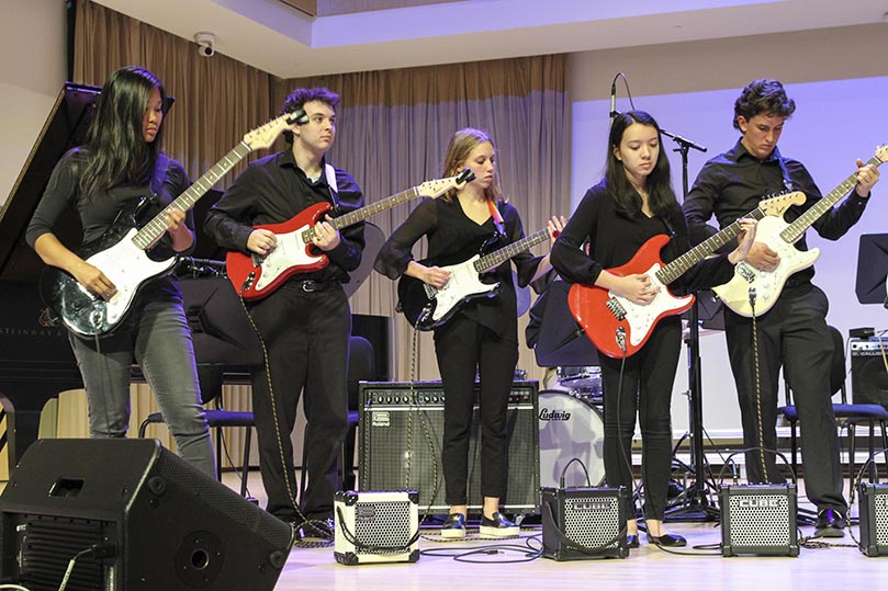 (L-r) Vy Nguyen, Ben Wulkan, Reagan Andrews, Sarah Escoffery and Cooper Harlan practice a song before the actual Nov. 20 performance last year at the Dr. Bailey & Family Performance Center, Morgan Hall, on the campus of Kennesaw State University, Kennesaw. Escoffery and Andrews are the only freshman and sophomore, respectively, in the advanced guitar ensemble. Photo By Michael Alexander