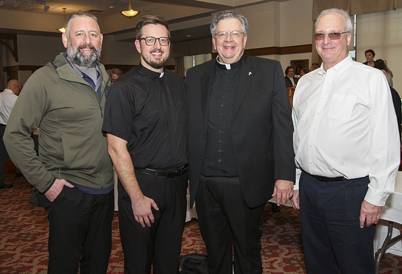 On hand for the diaconate ordination of James Grebe, second from right, were his brother Deacon John from the Diocese of Rockville Centre (New York), his son Father James from the Diocese of Pensacola-Tallahassee and his brother Deacon Andy from the Diocese of Albany (New York). Deacon James Grebe is assigned to Holy Family Church, Marietta. Photo By Michael Alexander 