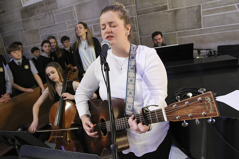 (Clockwise, from foreground) Kate Curran, assistant youth minister at the Cathedral of Christ the King, Atlanta, Lauren Nichols from the Georgia Tech Catholic Center, Ashley Dean, creative content specialist at Prince of Peace Church, Flowery Branch, and Patrick Williams from the Georgia Tech Catholic Center provide the music during the 31st annual Mass for the Unborn. Photo By Michael Alexander