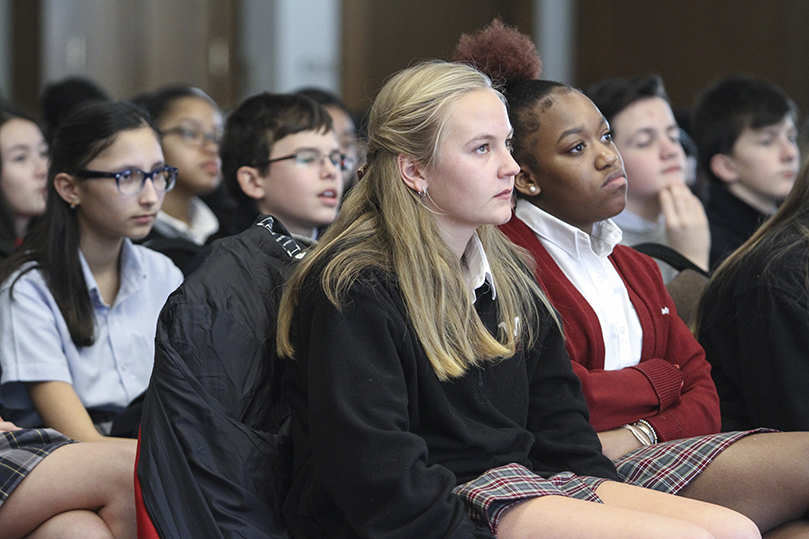 Our Lady of Mercy High School sophomores Erica Bryant, front row, left and Trinity Henry attend the archdiocese’s first Youth Rally for Life in the Cathedral of Christ the King’s Kenny Hall. The school’s entire sophomore class attended the Mass and rally as part of their sophomore retreat. Photo By Michael Alexander