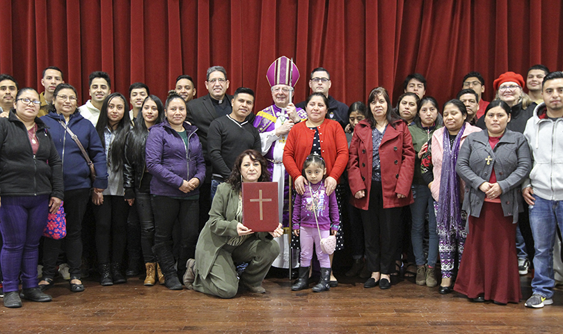 During the reception that followed the Feb. 29 Rite of Election and the Call to Continuing Conversion at St. Catherine of Siena Church, Kennesaw, catechumens, candidates, sponsors, members of the RCIA team and others from St. Bernadette Church pose for a group photo with diocesan administrator Bishop Joel M. Konzen, SM. The Cedartown parish has 12 catechumens and 25 candidates this year. Photo By Michael Alexander