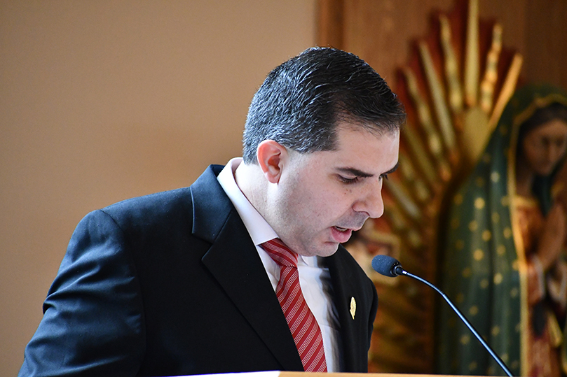 Leonardo Jaramillo reads the names of the 90 catechumens at Our Lady of the Americas Mission in Lilburn. Photo by Jackie Holcombe