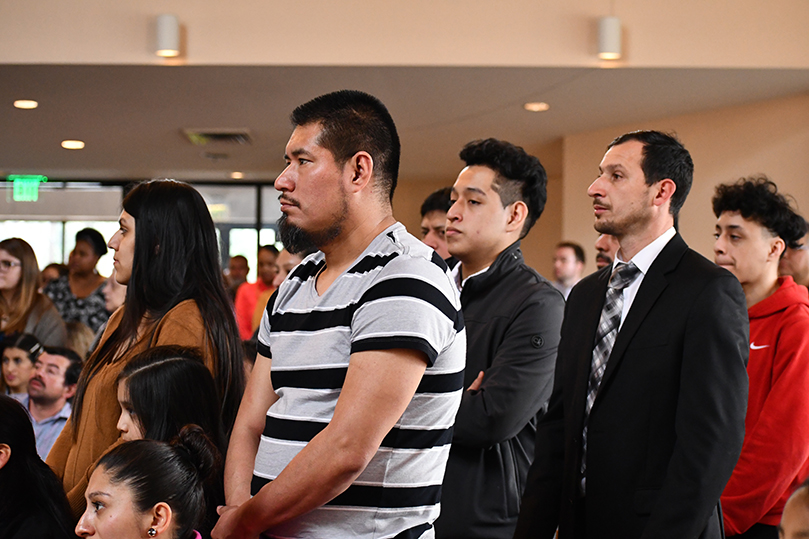 People stand during the presentation of catechumens for the March 1 Rite of Election and the Call to Continuing Conversion at St. Philip Benizi Church, Jonesboro. Photo by Jackie Holcombe