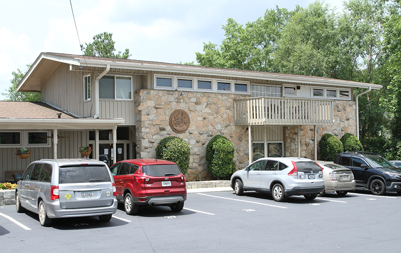 Images of St. Francis of Assisi, like the large, circular seal on the front of the Catholic Center at the University of Georgia, Athens, can be found around the center. Photo By Michael Alexander