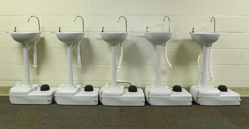 Students will find portable hand washing stations like the ones above strategically placed around St. Joseph School, Marietta, this year. Photo By Michael Alexander