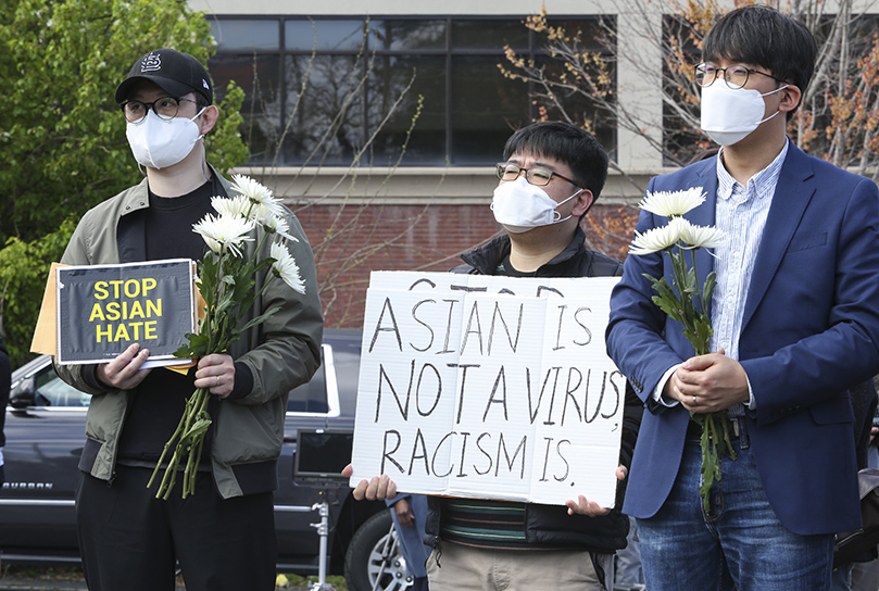 (L-r) Jinho Park, Dong Ho Han and Dong Hyun Jeong attend the March 21 interfaith prayer service at the Gold Spa. They were among the undergraduate and graduate students from Atlanta’s Emory University on hand for the prayer service. Photo By Michael Alexander