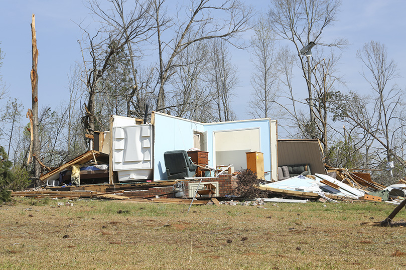 This image shows what remains of the neighbor’s brick home to the right of Alex and Millie Garza. Their neighbors huddled in the bathroom tub, white section, left, for safety during the tornado. Photo By Michael Alexander