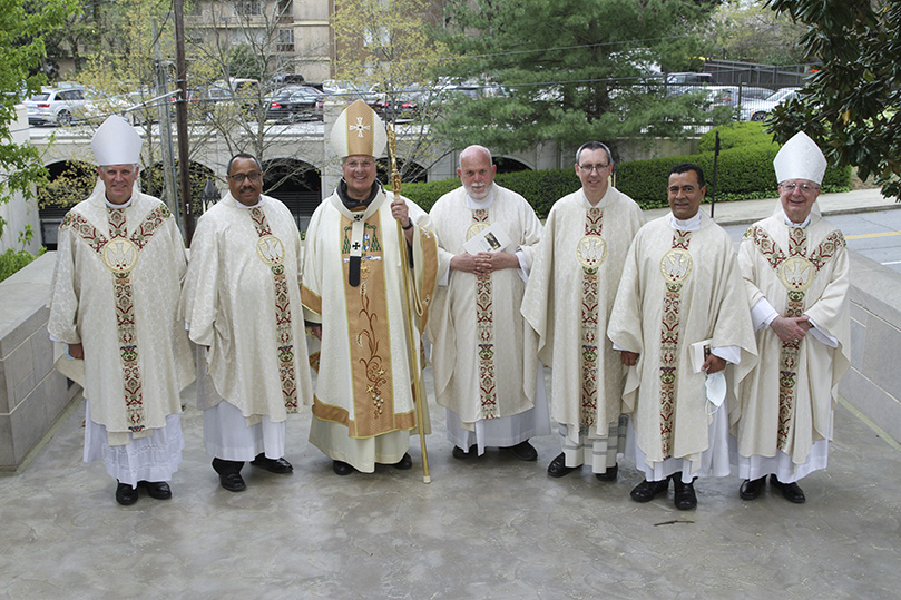 Archbishop Gregory J. Hartmayer, OFM Conv., third from left, and Bishop Joel M. Konzen, SM, far right, join silver jubilarians (l-r) Bishop Bernard E. Shlesinger III, Father Craig David, Father William Williams, Father Paul Burke and Father José González for a photograph after the Chrism Mass. Photo By Michael Alexander