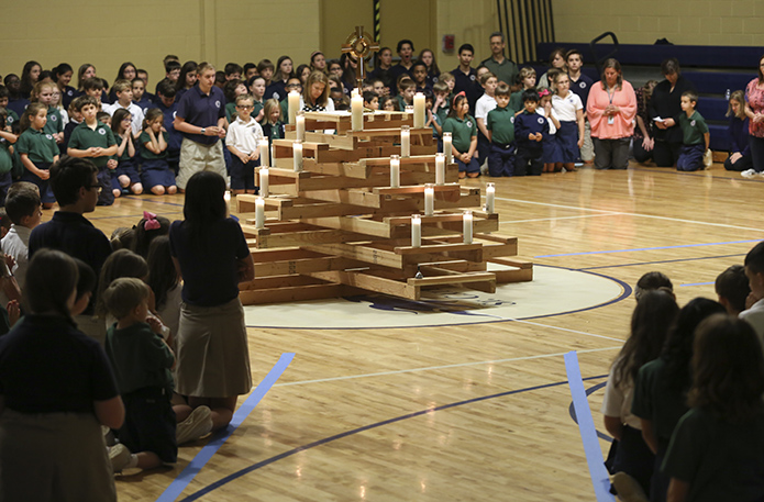 St. Catherine of Siena School students spend some time in prayer during exposition of the Blessed Sacrament. Adoration was held throughout the day during the school’s 2016 Faith Rally. Photo By Michael Alexander