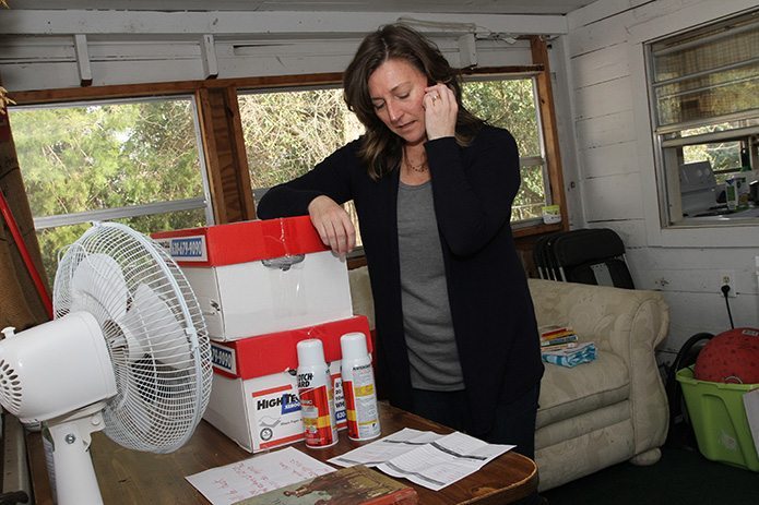 Amy Edwards, a cofounder of El Refugio along with her husband PJ, makes a call to some prospective Saturday evening guests to make sure their arrival should still be expected. Photo By Michael Alexander