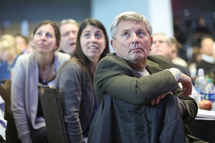 (Foreground to background) Bob Heilman, chair of the pastoral advisory council at St. Clare Mission, Acworth, the mission’s social committee chair Charlotte Kindler, and its youth minister Beth Tow watch a video about music ministry and music styles. Photo By Michael Alexander