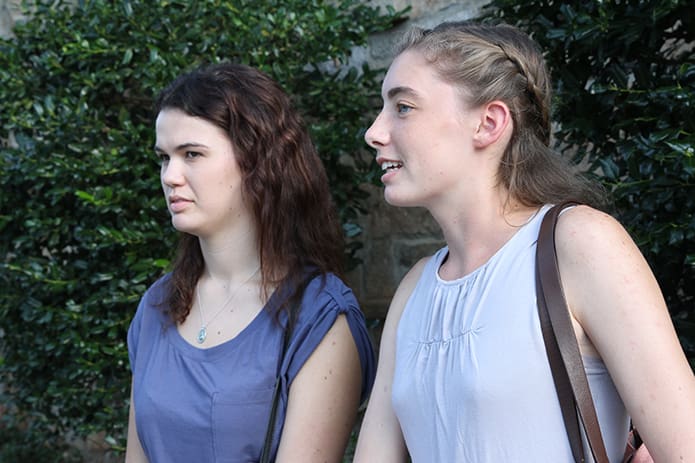 Sophomores Sarah Scherer, left, of San Diego, Calif., and Ingrid Pedersen of Thomson, Ga., felt that the archbishop’s comments emphasized their role as Catholics to care about all people. Photo By Michael Alexander