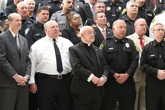 Msgr. R. Donald Kiernan stands among various members of law enforcement at the Georgia State Capitol. On the same day, March 8, 2011, Msgr. Kiernan was honored by the House of Representatives and the State Senate. Photo By Michael Alexander