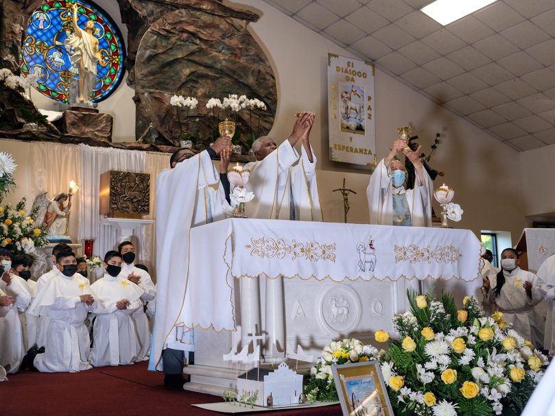 Bishop-designate Jacques E. Fabre-Jeune, CS, center, celebrated his farewell Mass at San Felipe de Jesús Mission in April prior to his departure to serve as leader of the Diocese of Charleston. Parishioners honored him afterward with an evening of food and music. Photo by Johnathon Kelso