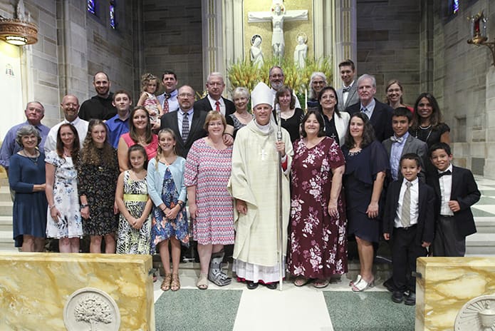 Bishop Bernard E. (Ned) Shlesinger III, bottom row, center, poses for a group photograph with the contingent of folks from the Diocese of Raleigh, who traveled to Atlanta for his July 19 episcopal ordination. Photo By Michael Alexander