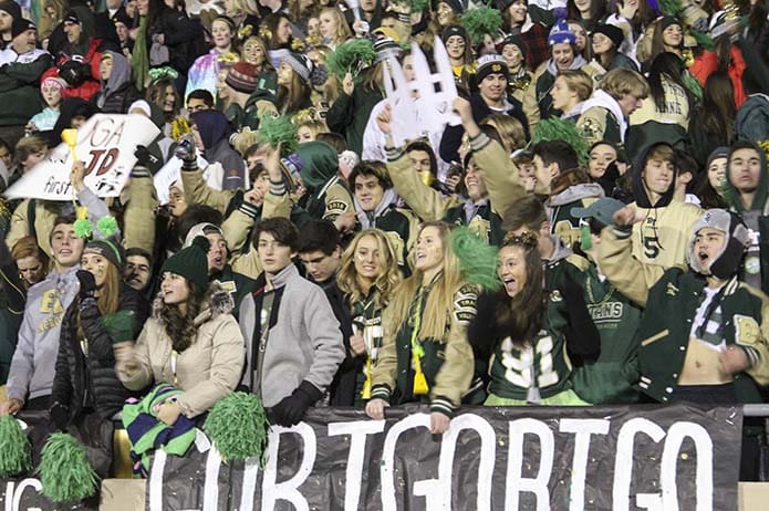 Blessed Trinity High School fans cheer as the team takes the field for pre-game warmups. Game time temperatures for the Dec. 15 championship game at Marist School's Hughes Spalding Stadium hovered around the mid 30s. Photo By Michael Alexander