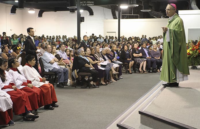 Bishop Luis Zarama delivers his homily to a vast crowd during the inaugural Mass at the Cathedral of Christ the King Mission, Atlanta. Photo By Michael Alexander