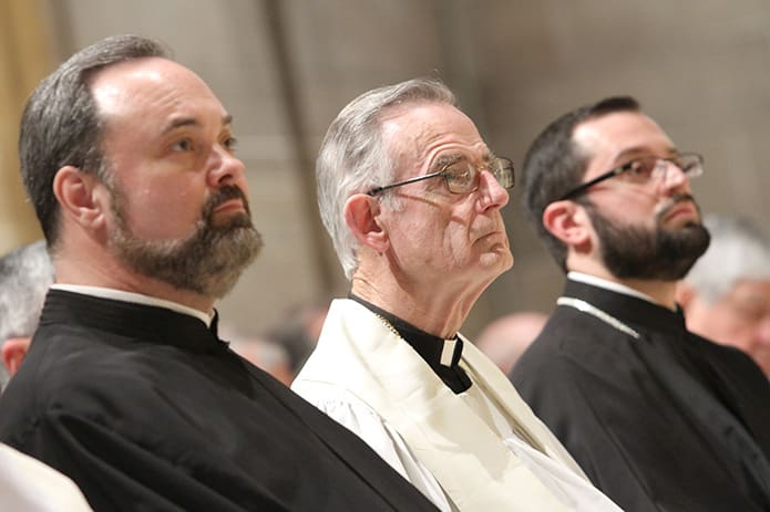 Roman Catholic priest Father John Kieran sits between Greek Orthodox presbyters Father Barnabas Powell, left, of Saints Raphael, Nicholas and Irene Greek Orthodox Church, Cumming, and Father Christos Mars, right, of the Greek Orthodox Cathedral of the Annunciation, Atlanta, during the May 20 Catholic-Orthodox Ecumenical Gathering. Photo By Michael Alexander