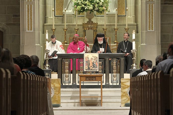 (L-r) Father Paul Burke, Archbishop Wilton D. Gregory, Catholic Archbishop of Atlanta, Metropolitan Alexios, Greek Orthodox Metropolis of Atlanta, and Father George Tsahakis come together during an ecumenical service marking the 50th anniversary of the momentous meeting of Pope Paul VI and Patriarch Athenagoras I in Jerusalem. Photo By Michael Alexander