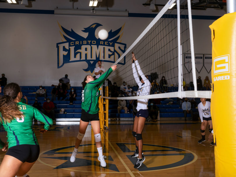 Notre Dame Academy's Eva Sponseller (#11) digs the ball to Cristo Rey players as they take a defensive position. Photo by Johnathon Kelso