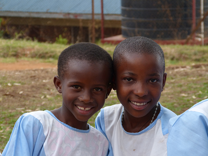 These children, part of a choir singing at Mass at the Cathedral of Cyangugu in Rwanda, were all smiles when greeting CRS delegates from America.