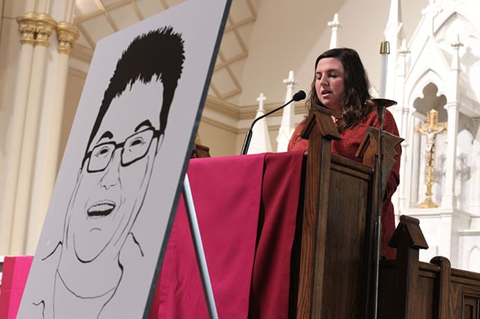 Kayla Gissendaner shares a testimony about her mother, Kelly Renee Gissendaner (displayed in a black and white drawing on the easel) during an educational summit on an interfaith call to halt the death penalty last month at the Shrine of the Immaculate Conception, Atlanta. Despite appeals to commute Kelly’s death sentence, she was executed just after 12 a.m. on Sept. 30. Photo By Michael Alexander