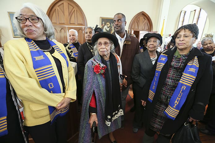 Emily Milner, second from left, a member of the Shrine of the Immaculate Conception, Atlanta, is joined by alumni from Our Lady of Lourdes School, Atlanta, including alumni president Janis Erwin Griffin, left, and corresponding secretary Karen Davenport Allen, foreground right. Milner is the oldest living alumna of the school. All were on hand to mark the 100th birthday of Milner at the Shrine’s 11 a.m. Mass. Photo By Michael Alexander