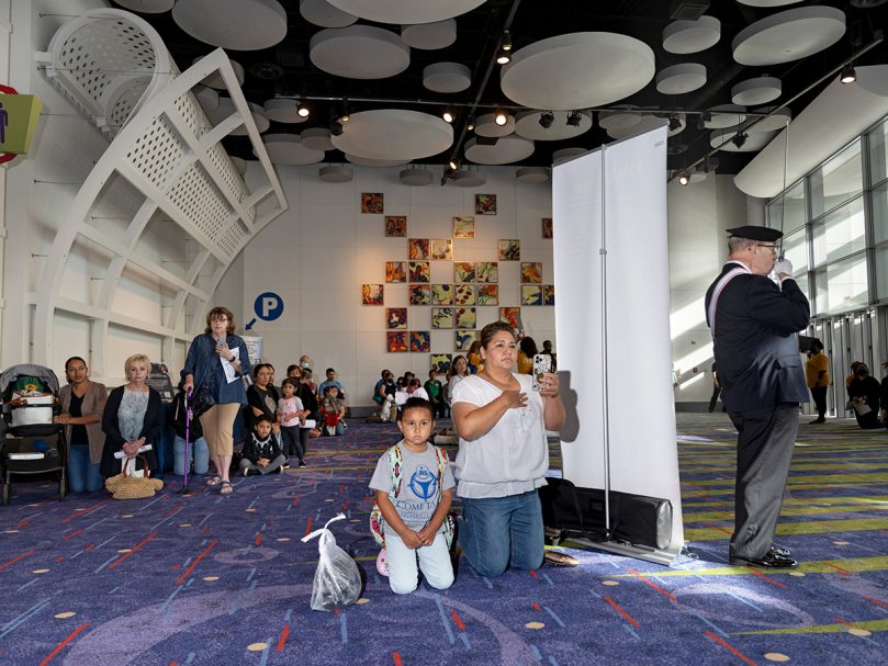 Visitors kneel during the morning procession of the Blessed Sacrament  at the Georgia International Convention Center June 18. The event launches a national period of eucharistic renewal. Photo by Johnathon Kelso