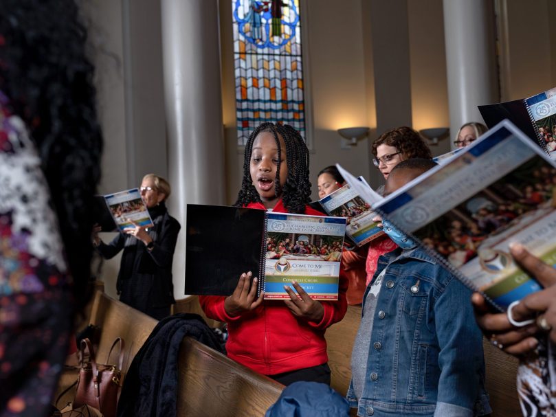 The Congress Choir rehearses at St. Andrew Church. The song selections reflect the theme of the 25th Eucharistic Congress, 