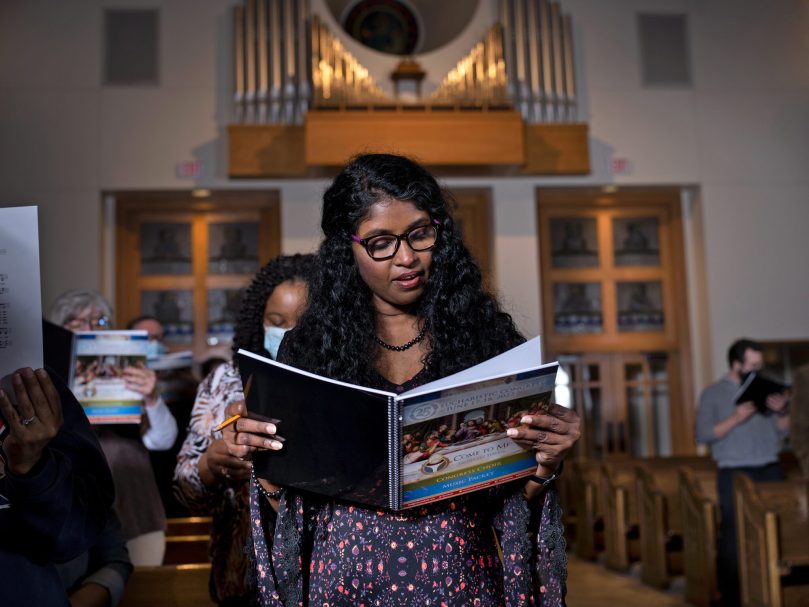 The Congress Choir rehearses at St. Andrew Church. The song selections reflect the theme of the 25th Eucharistic Congress, 