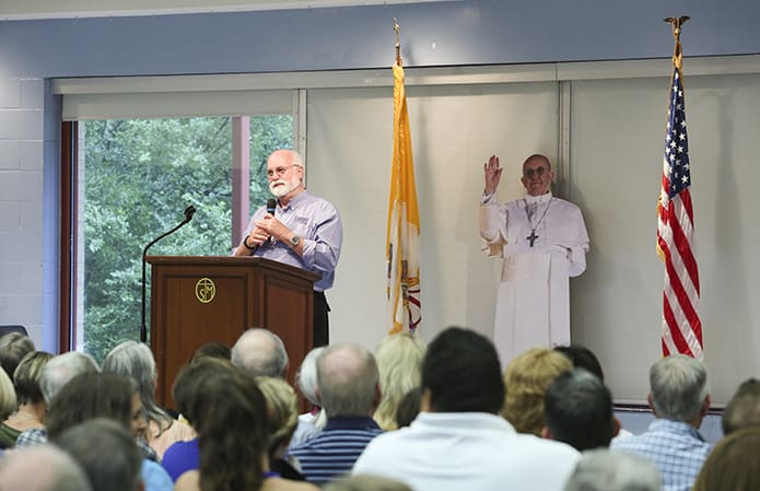 With a presentation on the serious issue of gang intervention, doused with antidotes of humor, Jesuit Father Gregory Boyle, founder and executive director of Homeboy Industries in Los Angeles, Calif., speaks to a large crowd at St. Thomas More Church, Decatur. He started out by saying it was the first time he ever recalls being “photo bombed” by Pope Francis. Photo By Michael Alexander