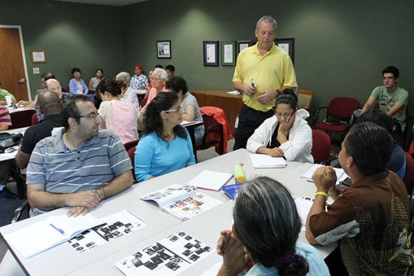 Lead instructor James McDonough, standing, conducts the Tuesday morning English Literacy class at the Senior Connections Building in Chamblee for some 30 students. Photo By Michael Alexander