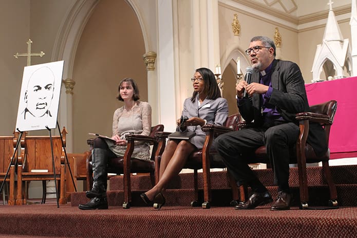 (R-l) Bishop Robert C. Wright of the Episcopal Diocese of Atlanta, Terrica Redfield Ganzy, development director for the Southern Center for Human Rights, Atlanta, and Caitlin Childs, organizing director, real communities initiative, for the Georgia Council on Developmental Disabilities, conducted a panel discussion and also took questions from the congregation. Photo By Michael Alexander