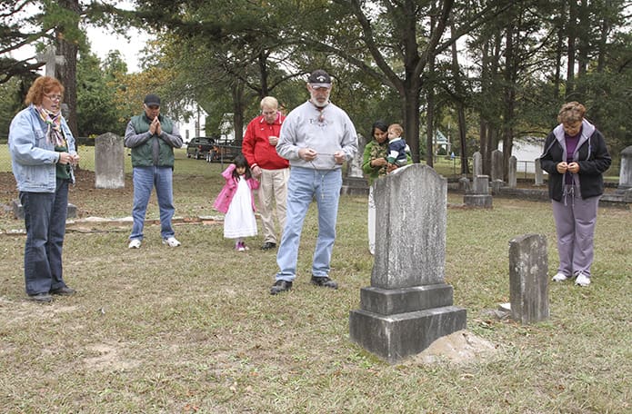 After leaving the Locust Grove Cemetery, a small group of parishioners from St. Joseph Church in Washington went to the Purification Cemetery, which is across the street from the current Church of the Purification in Sharon, to pray the rosary. Photo By Michael Alexander