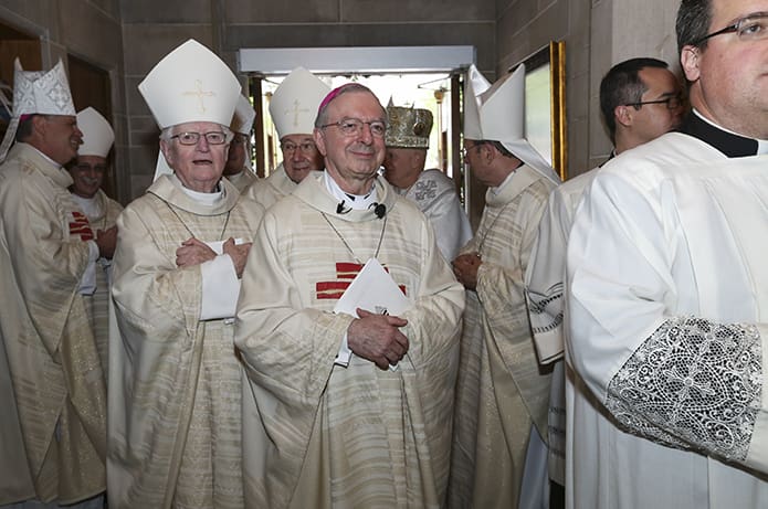 Standing in the narthex among the bishops present for his episcopal ordination, Bishop-designate Joel M. Konzen, SM, center, watches the deacons, priests and seminarians process into the Cathedral of Christ the King, Atlanta. Photo By Michael Alexander