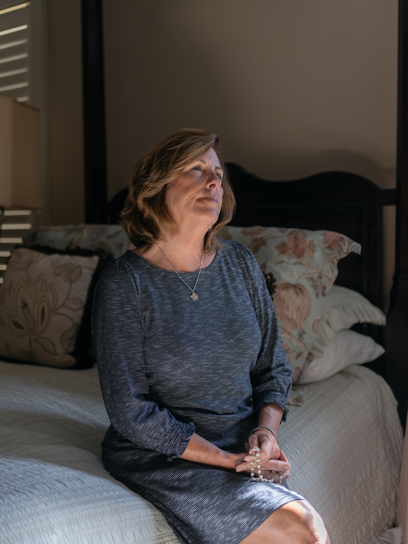 Betsy Orr, president of the Purification Heritage Center,  prays the rosary at her home in Washington. Photo by Johnathon Kelso