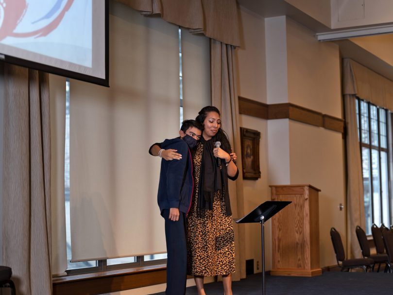 Guest speaker Julieta Sanchez Acosta hugs her son after giving her testimony to students at the Youth Rally for Life at the Cathedral of Christ the King.