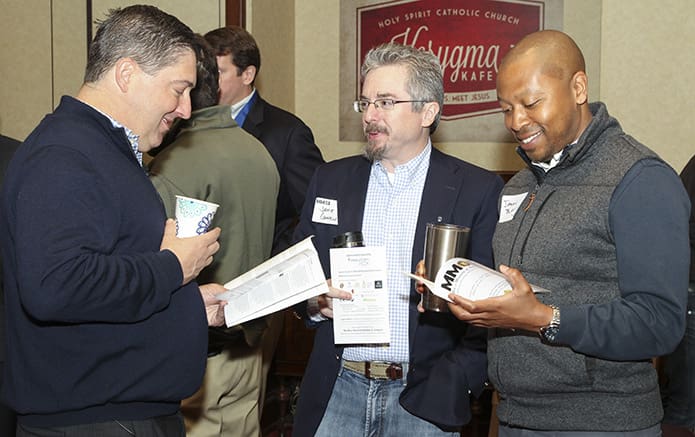 (L-r) Mike Schaeffer of the Cathedral of Christ the King, Atlanta, and Jamie Connelly and Jason Blake of Holy Spirit Church, Atlanta, gather for a moment of fellowship prior to the Men's Morning of Spirituality. Schaeffer was the witness speaker for the morning program. Photo By Michael Alexander