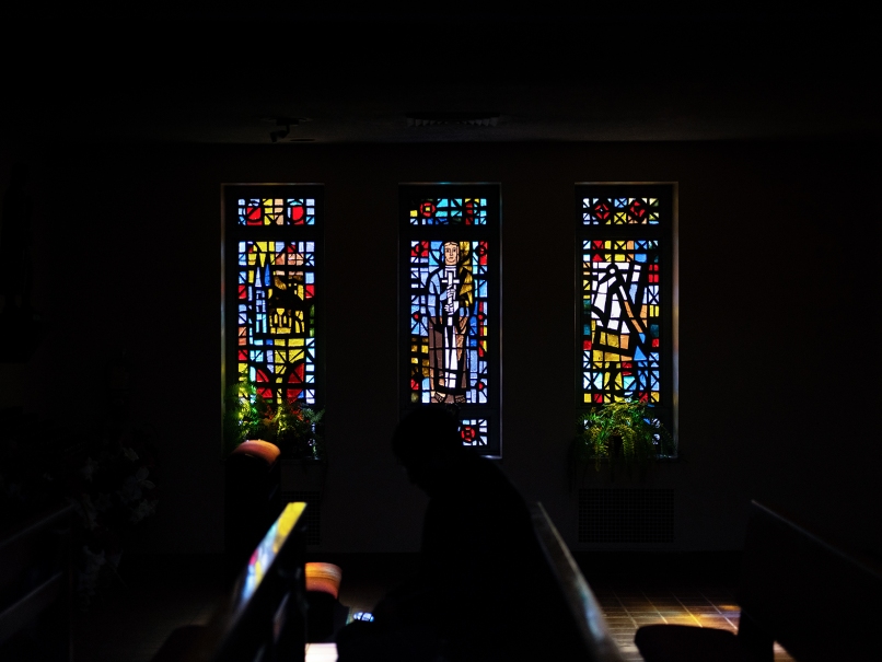 A parishioner prays before the annual archdiocesan Mass  in memory of Martin Luther King Jr., at St. Paul of the Cross Church, Atlanta. Photo by Johnathon Kelso