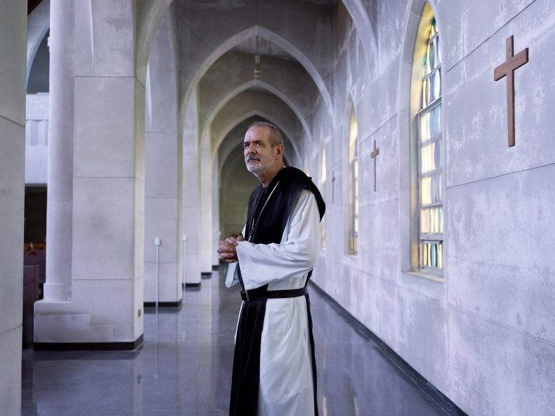 Abbot Augustine Myslinski, OCSO, is photographed inside the sanctuary at the Monastery of the Holy Spirit in Conyers. The abbot said recent renovations were focused on the heart of the monks' life, their communal prayer. Photo by Johnathon Kelso