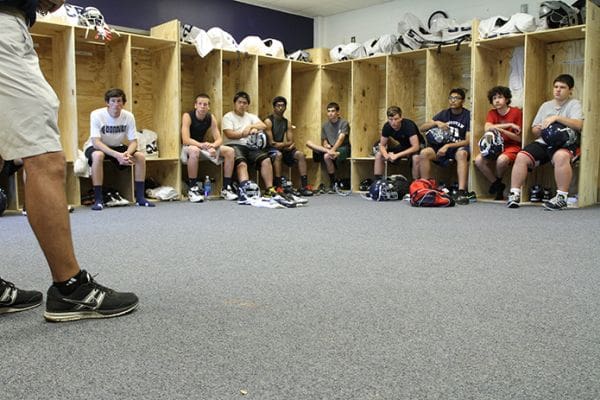 In late May head coach Kurt Page addresses the Monsignor Donovan team prior to the first football scrimmage in its history against Augusta Prep. Photo By Michael Alexander