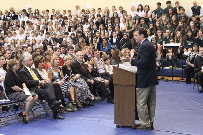 Prior to the showing of a 20th anniversary slideshow presentation, Ed Lindekugel, Pinecrest Academy upper school principal, addresses the crowd on hand. Photo By Michael Alexander