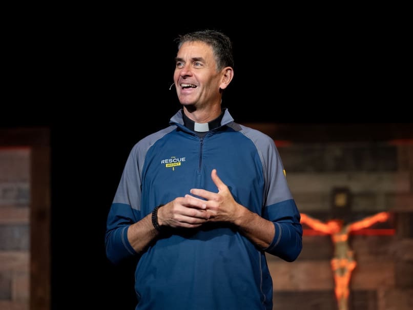 Father John Riccardo speaks to the crowd during Rescue Atlanta at the Cobb Galleria Centre. Photo by Johnathon Kelso