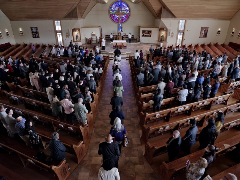 RCIA directors process to the altar holding the Books of the Elect during the Rite of Election at St. Catherine of Siena Church. Two other parishes hosted rites the same morning. Photo by Johnathon Kelso