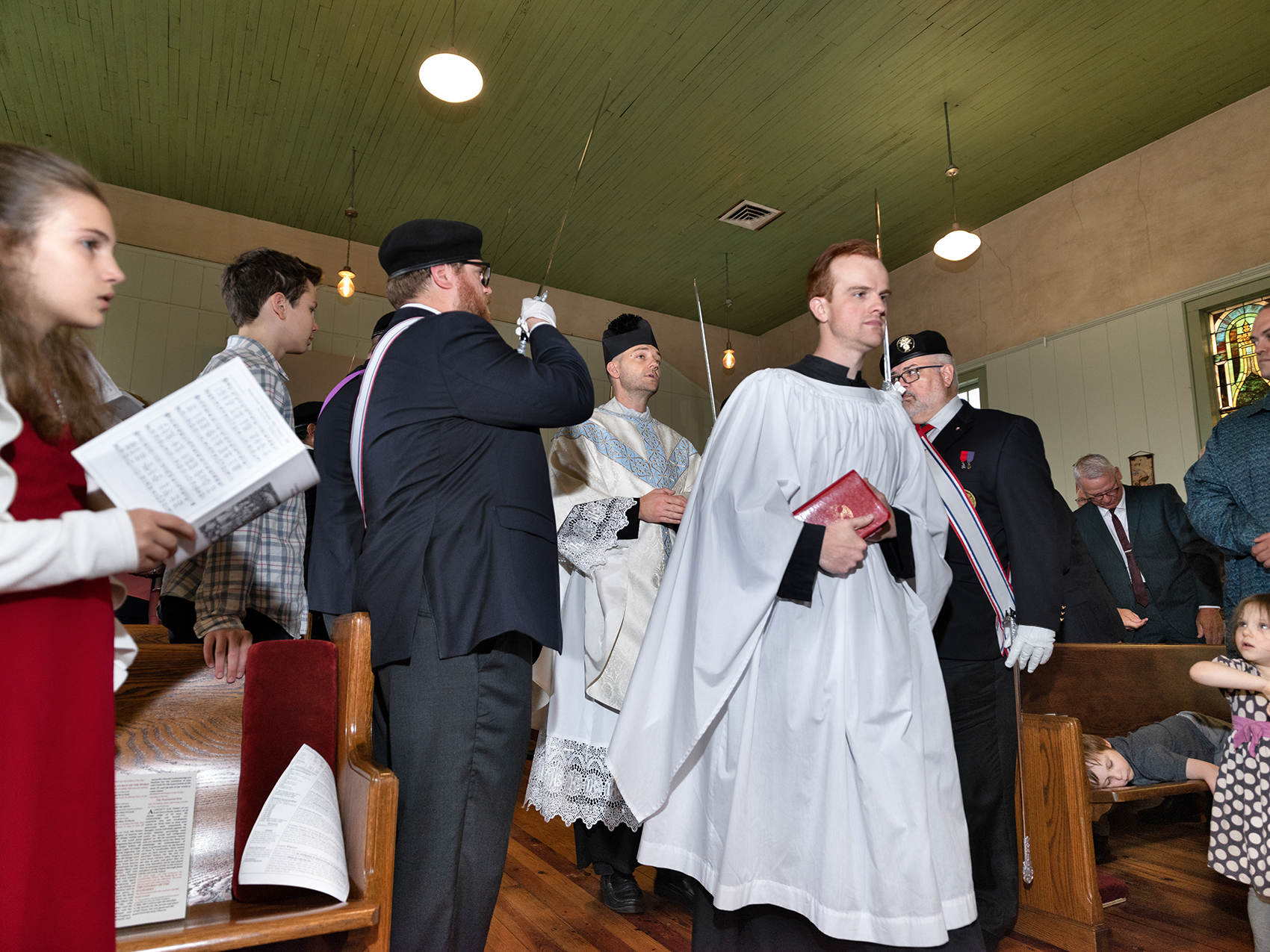 Father Gregory Tipton, pastor of St. Aelred Church in Bishop, processes in during the Mass held on the Feast of Corpus Christi. Photo by Johnathon Kelso