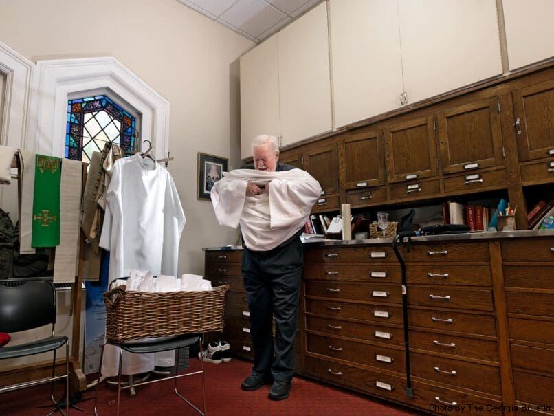 Msgr. Henry Gracz, pastor, prepares to celebrate the Mass at The Catholic Shrine of the Immaculate Conception. Photo by Johnathon Kelso