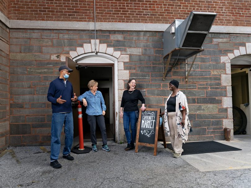 Shrine Community Market volunteers include,  from left to right, Gino Lloyd, Janice St. Hilaire, Tilla Jones and Van DeLisa Rachel.  The program allows customers in need to shop for free staples from laundry detergent to canned goods.Photo by Johnathon Kelso