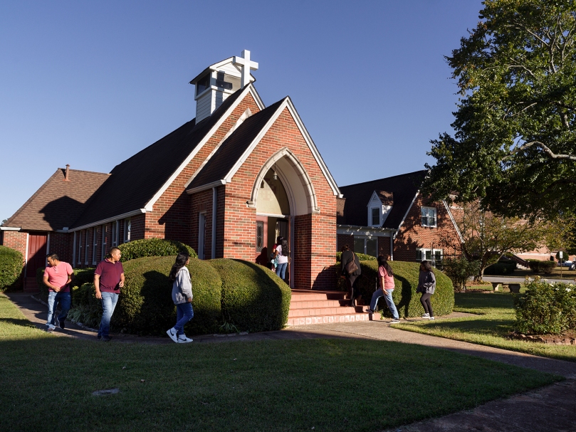 The faithful enter for Mass with The Sisters Poor of Jesus Christ at their convent at Fraternitas St. Katherine Drexel, the original church building of St. Bernadette. Photo by Johnathon Kelso