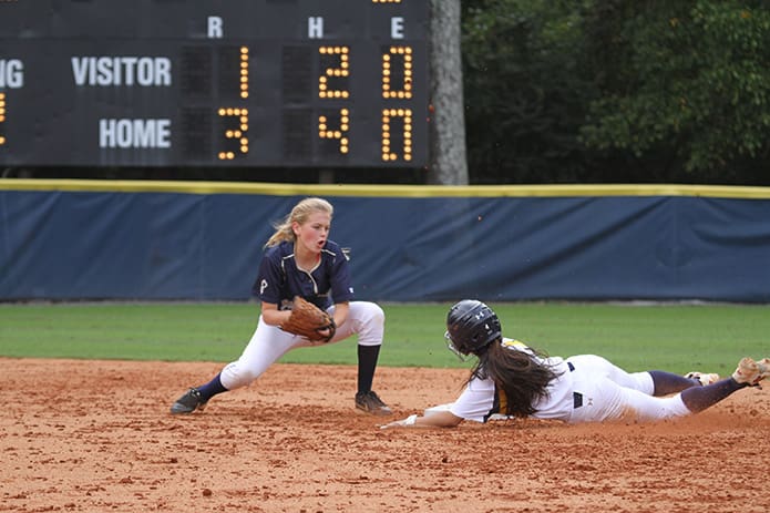 St. Pius' Bartles secures the ball and Marist's Teran grabs the second base bag. Photo By Michael Alexander